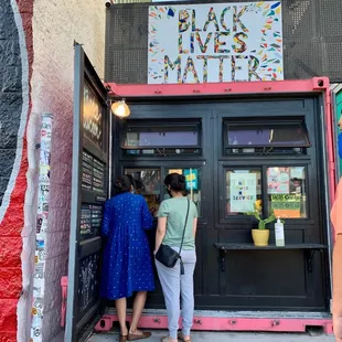 two people entering a black lives matter restaurant