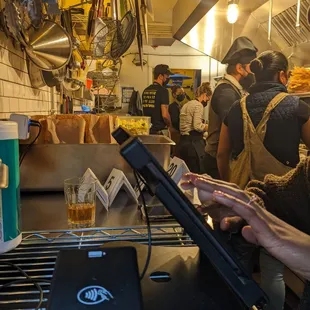 a man using a laptop in a restaurant
