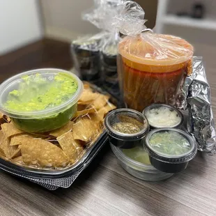 Pork posole with all the accoutrements plus chips, guacamole &amp; salsa