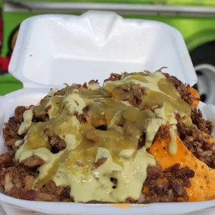 Custom nachos with asada guacamole sauce and salsa verde Photos by A.A.Serrano.Photography on ig