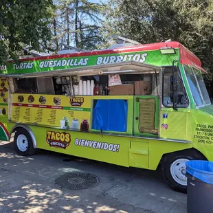 a taco truck parked on the side of the road