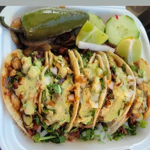 Tacos al Pastor with both guacamole &amp; red sauce!