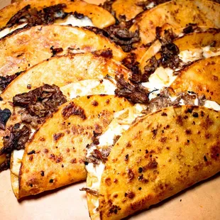 a variety of tacos in a box