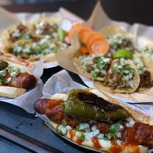 three hot dogs with toppings