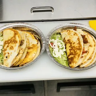 two trays of food on a table