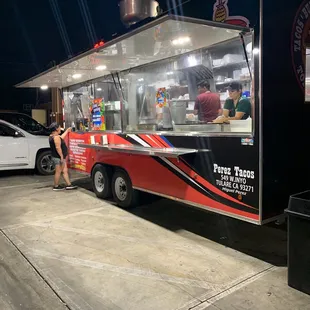 a taco truck parked in a parking lot