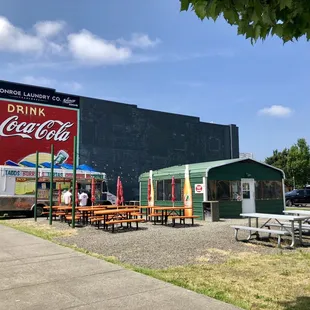 a large coca cola sign on the side of a building