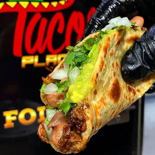 Our Taco De Harina is topped with beans &amp; guacamole