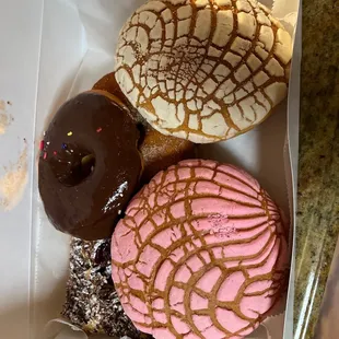 a variety of donuts in a box