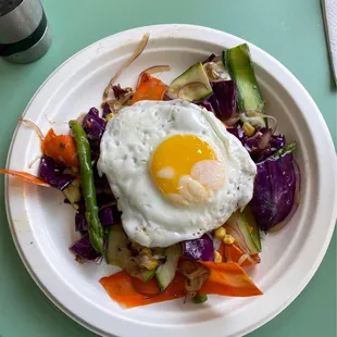 Special Healthy dish by Pedro (the owner) Corn Cabbage Asparagus red onions carrots zucchini and sunny side up!