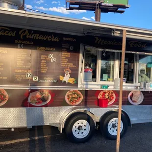 a food truck with menus on the side