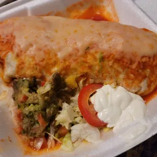 a burrito in a styrofoam container