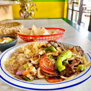 Shrimp, steak and chicken fajitas