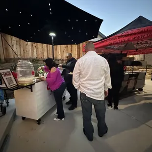  group of people at a stand