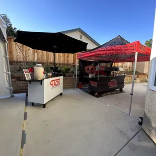  taco stand with a red umbrella