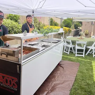  man serving hot dogs