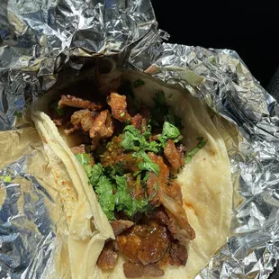 Crispy tripa taco with cilantro red salsa