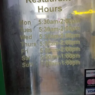a restaurant hours sign