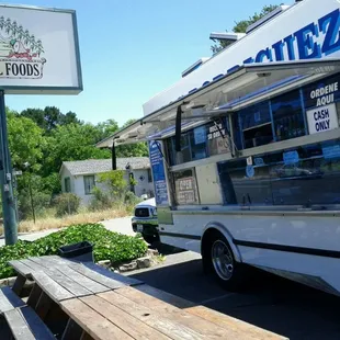 a food truck parked in front of a restaurant