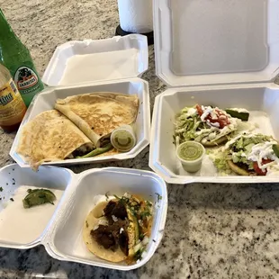 Taco de lengua, sopes con asada y quesadilla de asada. Not pictured are the other two sopes con pollo.