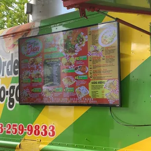 a man standing in front of a food truck