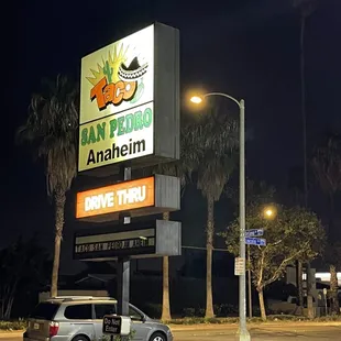 a car parked in front of a taco restaurant