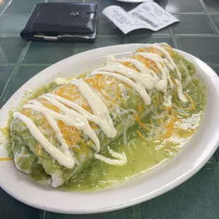 Wet carne asada burrito with salsa verde.  Work of art