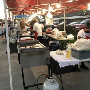 a group of people preparing food