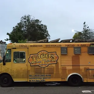 a taco truck parked in a parking lot