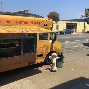 a taco truck parked on the side of the road