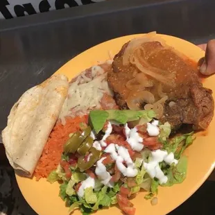 a person holding a plate of food