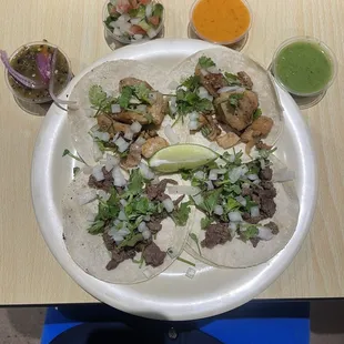 Two chicken and two steak tacos along with my favorite side salsas!