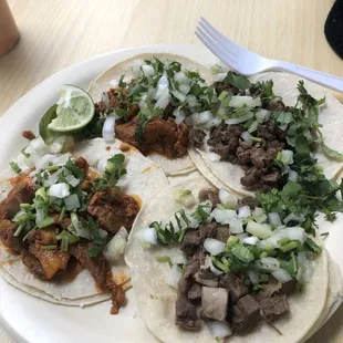 Two al pastor, one carne asada, and one lengua.