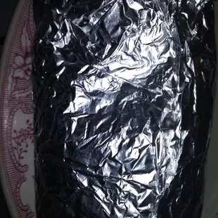 a piece of cake wrapped in tin foil