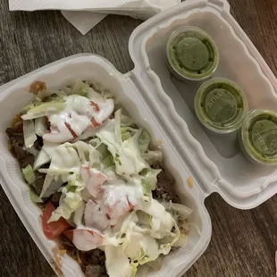 two take out containers of food