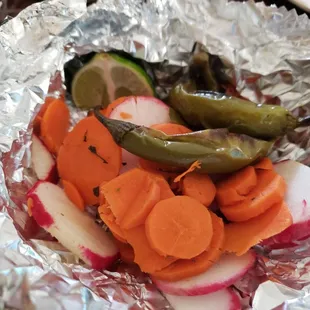 Comes with a side of radishes,  carrots and jalapeños