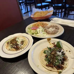 Fish and al pastor tacos