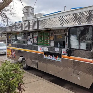a food truck parked on the side of the road