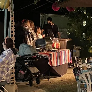 a group of people sitting around a table