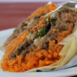 a taco filled with meat and vegetables
