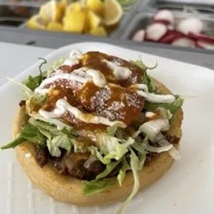 a taco sandwich on a bun