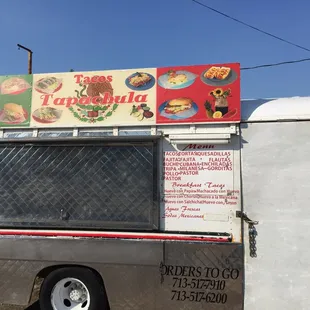 a taco truck parked on the side of the road