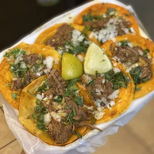 a person holding a plate of food