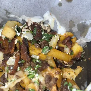Tapatio Fries, half carne asada and el pastor