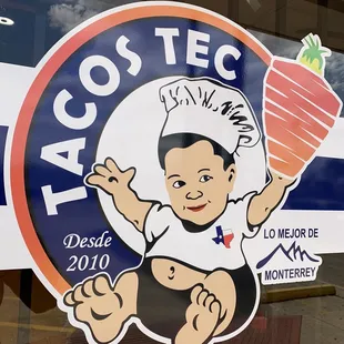 a baby holding a carrot