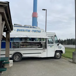 a taco truck parked in front of a building