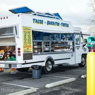 a taco truck parked in a parking lot