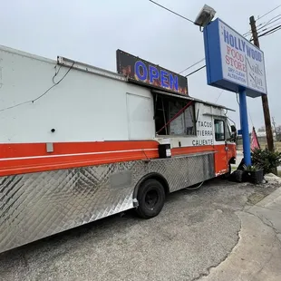 a taco truck parked on the side of the road