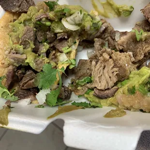 a plate of meat and vegetables