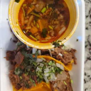 a bowl of soup and a taco